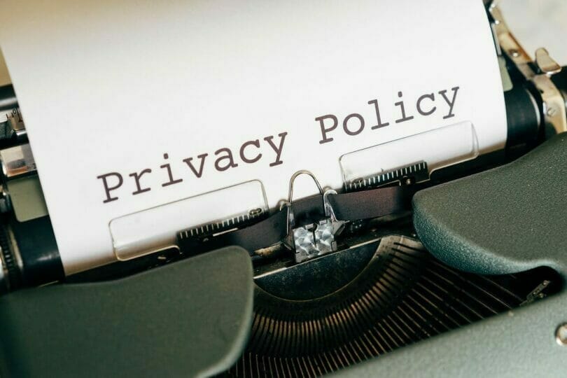 Typewriter with "Privacy Policy" typed on white paper.